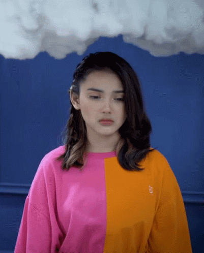 Woman in Pink and Orange Sweater with Letter S