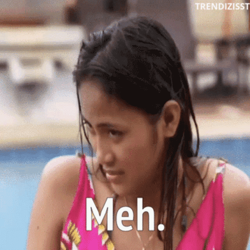 Woman in Pink Bathing Suit Saying Meh