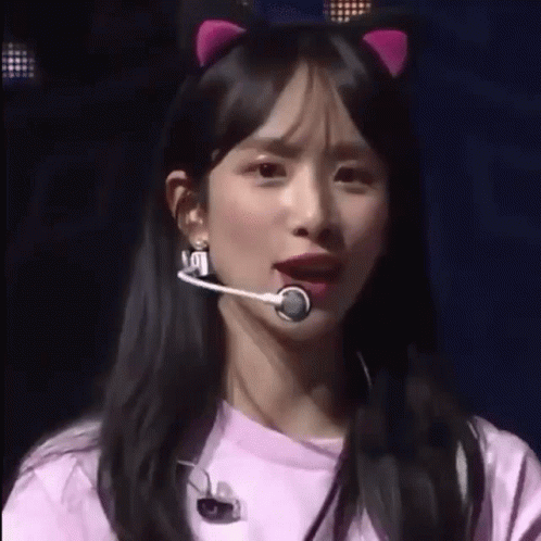 Woman in Pink Cat Ear Headband with Microphone