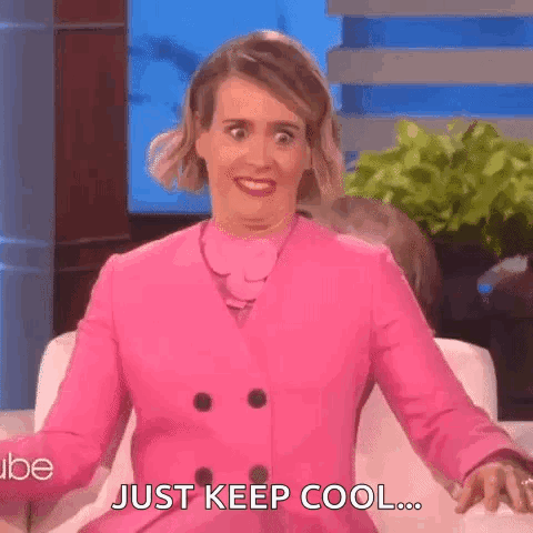 Woman In Pink Coat Making Funny Face GIF