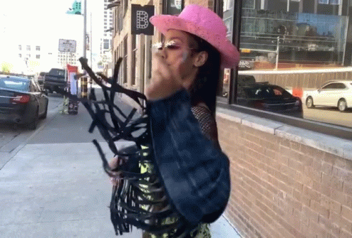 Woman in Pink Cowboy Hat with Sign B