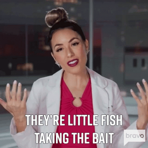 Woman in Pink Dress and White Coat Says They're Little Fish Taking the Bait