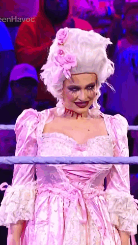 Woman In Pink Dress And Wig In Boxing Ring GIF