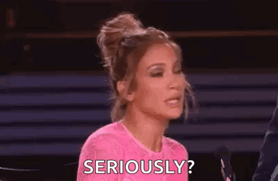 Woman in Pink Dress Asking Seriously