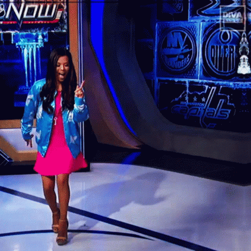 Woman In Pink Dress Blue Jacket Capitals Wall GIF
