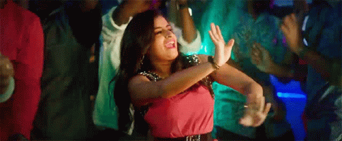 Woman in Pink Dress Dancing at Party
