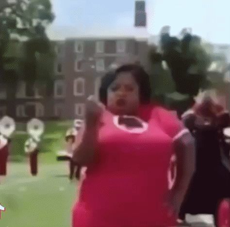 Woman in Pink Dress Dancing Front of Band
