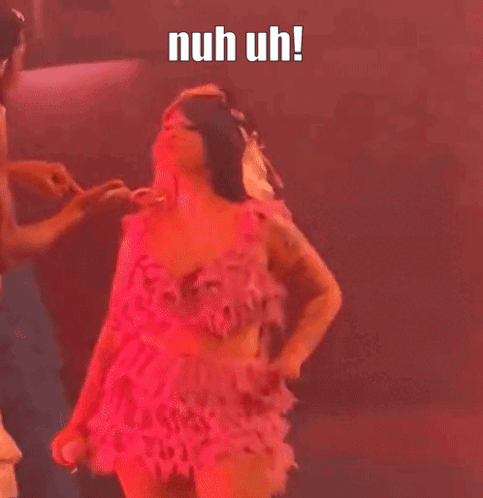 Woman in Pink Dress Dancing with Man Behind