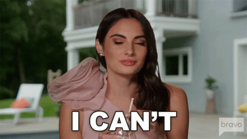 Woman in Pink Dress Holding Glass Saying I Can't