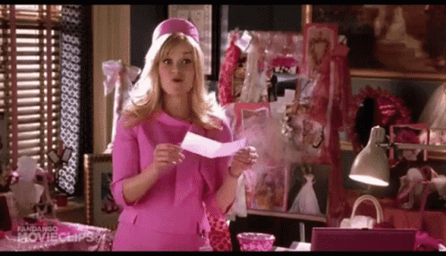 Woman In Pink Dress Holding Paper GIF
