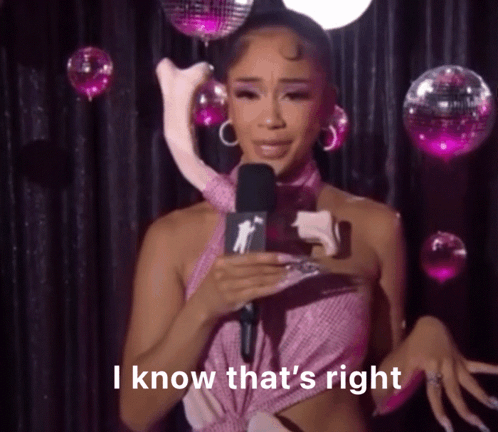 Woman in Pink Dress Holding Stuffed Animal