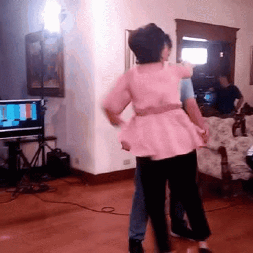 Woman in Pink Dress Hugging Man