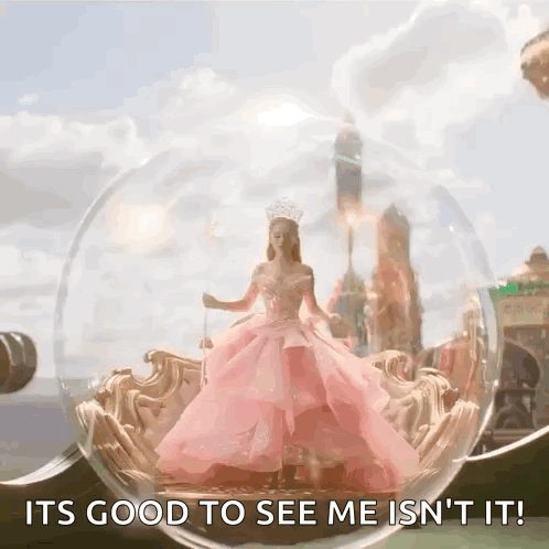 Woman in Pink Dress Inside Glass Ball Saying It's Good to See Me Isn't It