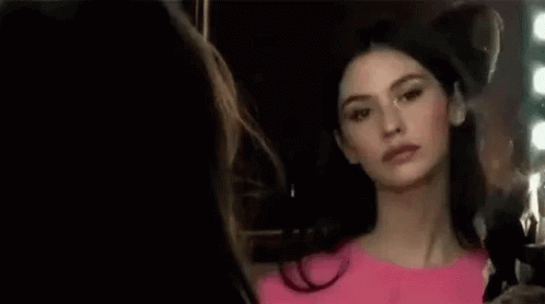 Woman in Pink Dress Looking in Mirror