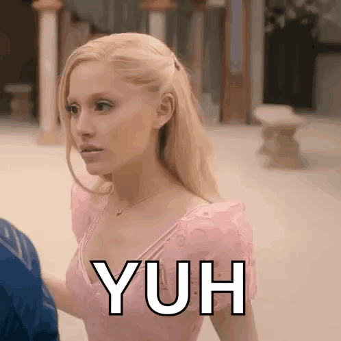 Woman in Pink Dress Next to Man Saying Yuh