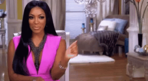 Woman In Pink Dress Pointing GIF