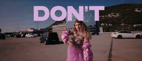 Woman in Pink Dress Saying Don't