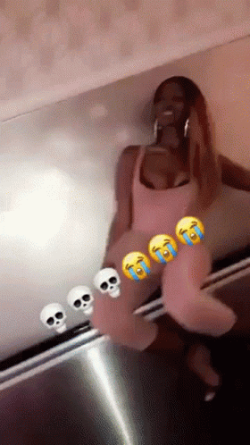 Woman in Pink Dress Sitting in Front of Skull Wall