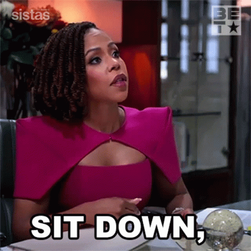 Woman in Pink Dress Sitting With Sit Down