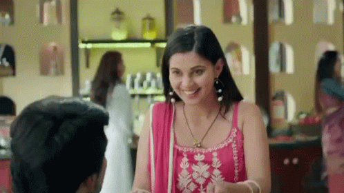 Woman in Pink Dress Smiling at Man