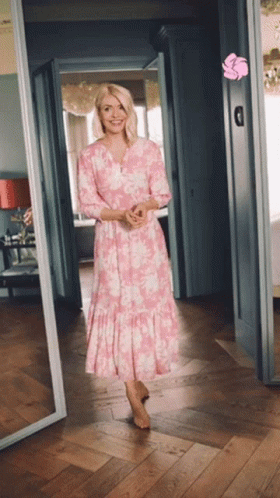 Woman in Pink Dress Standing in Hallway