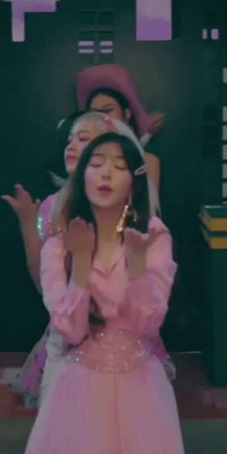 Woman In Pink Dress Standing With Others GIF