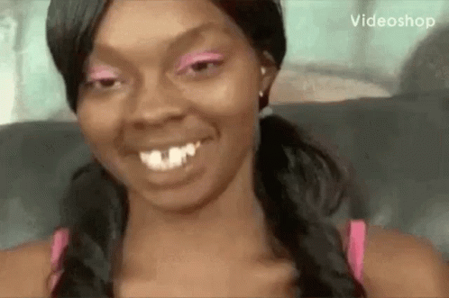 Woman in Pink Eyeshadow and Pigtails Smiling