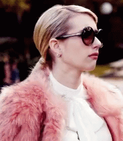 Woman in Pink Fur Coat and Sunglasses