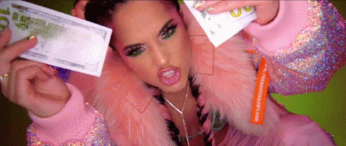 Woman In Pink Fur Coat Holding $10 Bill GIF