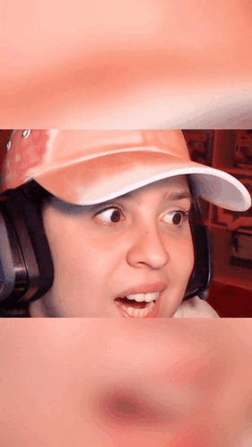 Woman in Pink Hat and Headphones Surprised