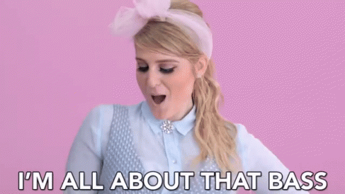 Woman In Pink Headband Saying I'm All About That Bass GIF