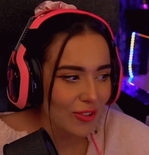 Woman in Pink Headphones at Microphone