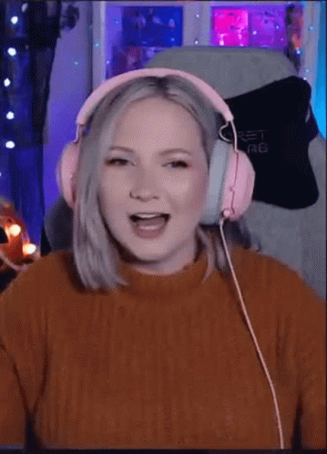 Woman in Pink Headphones Laughing