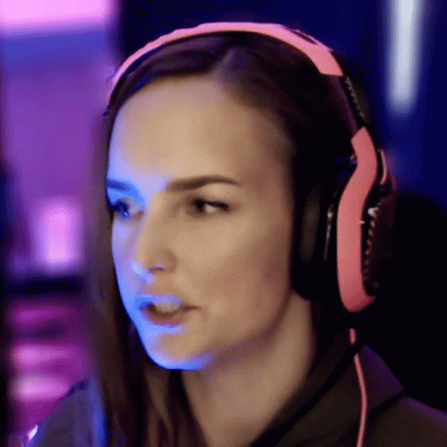 Woman In Pink Headphones Looking At Camera GIF