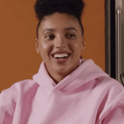 Woman In Pink Hoodie Smiling With Mouth Open GIF