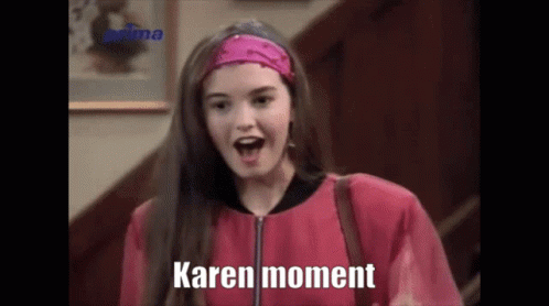 Woman in Pink Jacket, Headband Saying Karen Moment