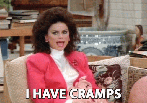 Woman in Pink Jacket Saying I Have Cramps