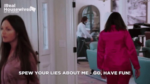 Woman in Pink Jacket Walking Hallway Saying Spew Your Lies About Me
