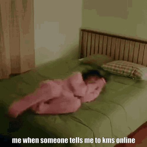 Woman in Pink Pajamas on Bed Saying Me When Someone Tells Me to KMS Online