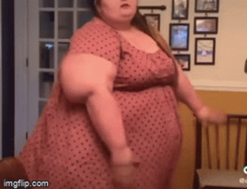 Woman in Pink Polka Dot Dress Dancing