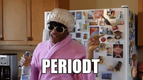 Woman in Pink Robe and Hat Pointing at Periodt