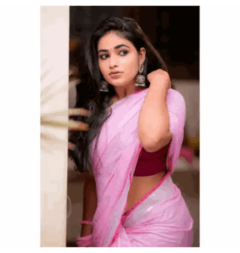 Woman in Pink Saree and Earrings