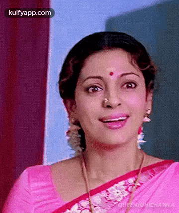 Woman in Pink Saree and Nose Ring Smiling