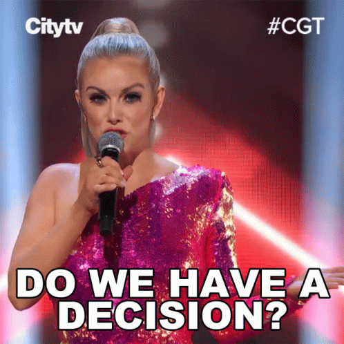 Woman in Pink Sequined Dress Holding Microphone Says Do We Have a Decision