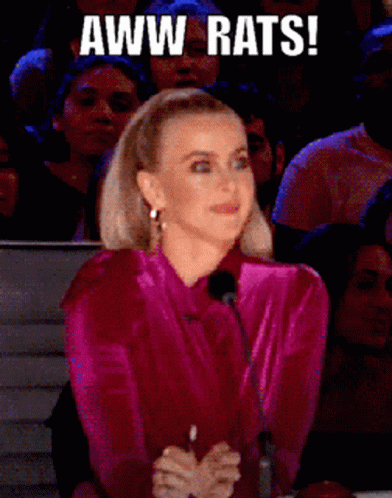 Woman in Pink Shirt Aww Rats in Front of Crowd