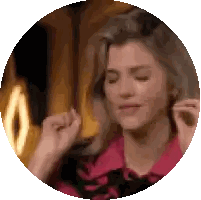 Woman in Pink Shirt Dancing with Eyes Closed