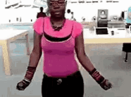 Woman in Pink Shirt Dancing