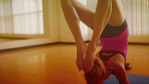 Woman in Pink Shirt Doing Handstand