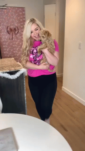 Woman In Pink Shirt Holding Dog GIF