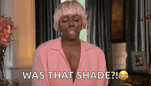 Woman in Pink Shirt Laughing Saying Was That Shade